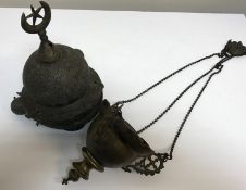 A Turkish pierced brass temple / sanctuary lantern together with another similar,