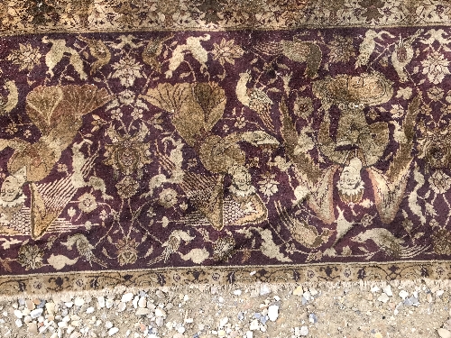 An early 20th Century Agra North India carpet with centre medallion on a wine-coloured ground, - Image 81 of 103