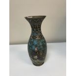 A chinese cloisonne vase of baluster form with flared lip decorated with figures playing musical