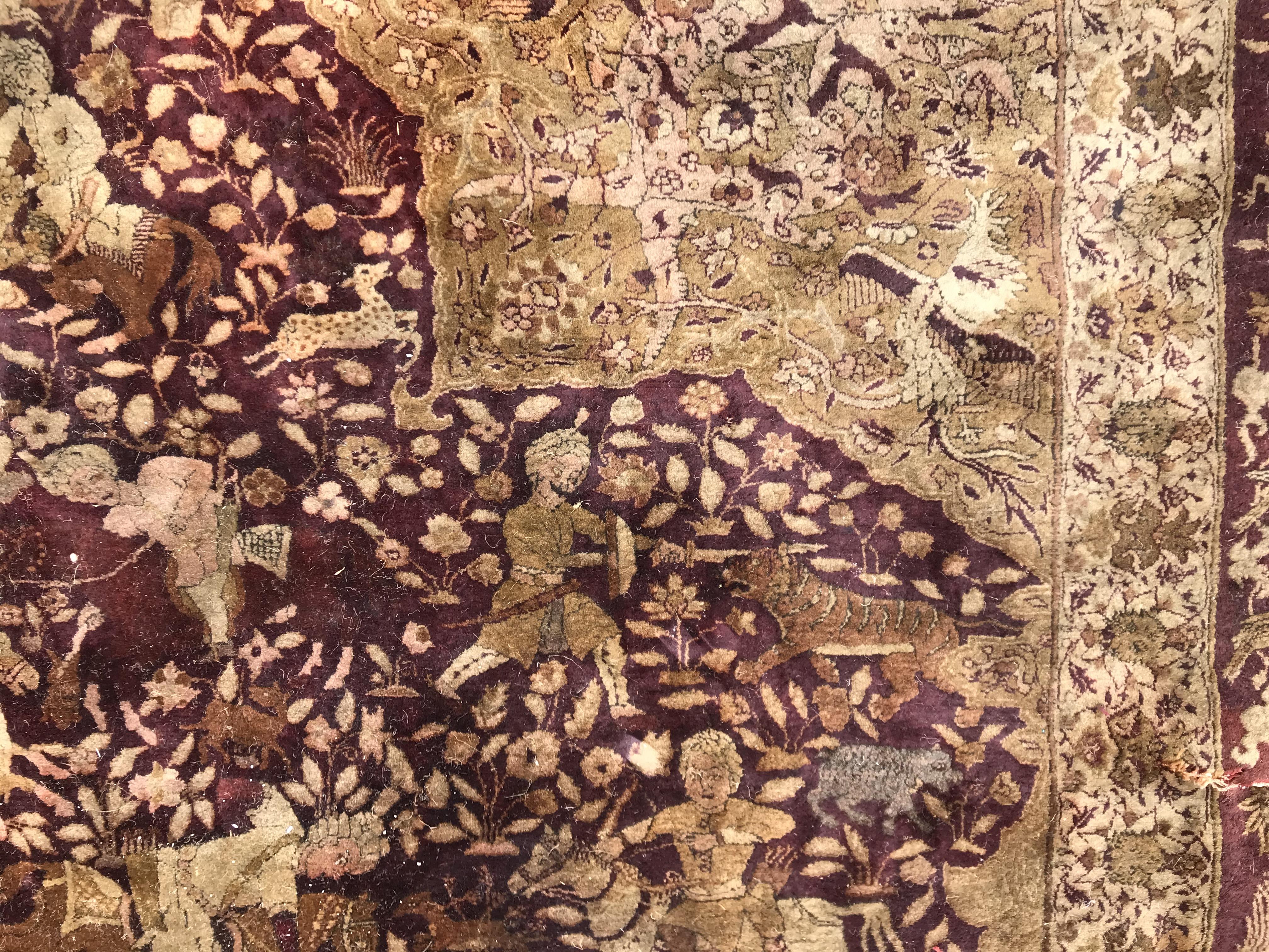 An early 20th Century Agra North India carpet with centre medallion on a wine-coloured ground, - Image 65 of 103