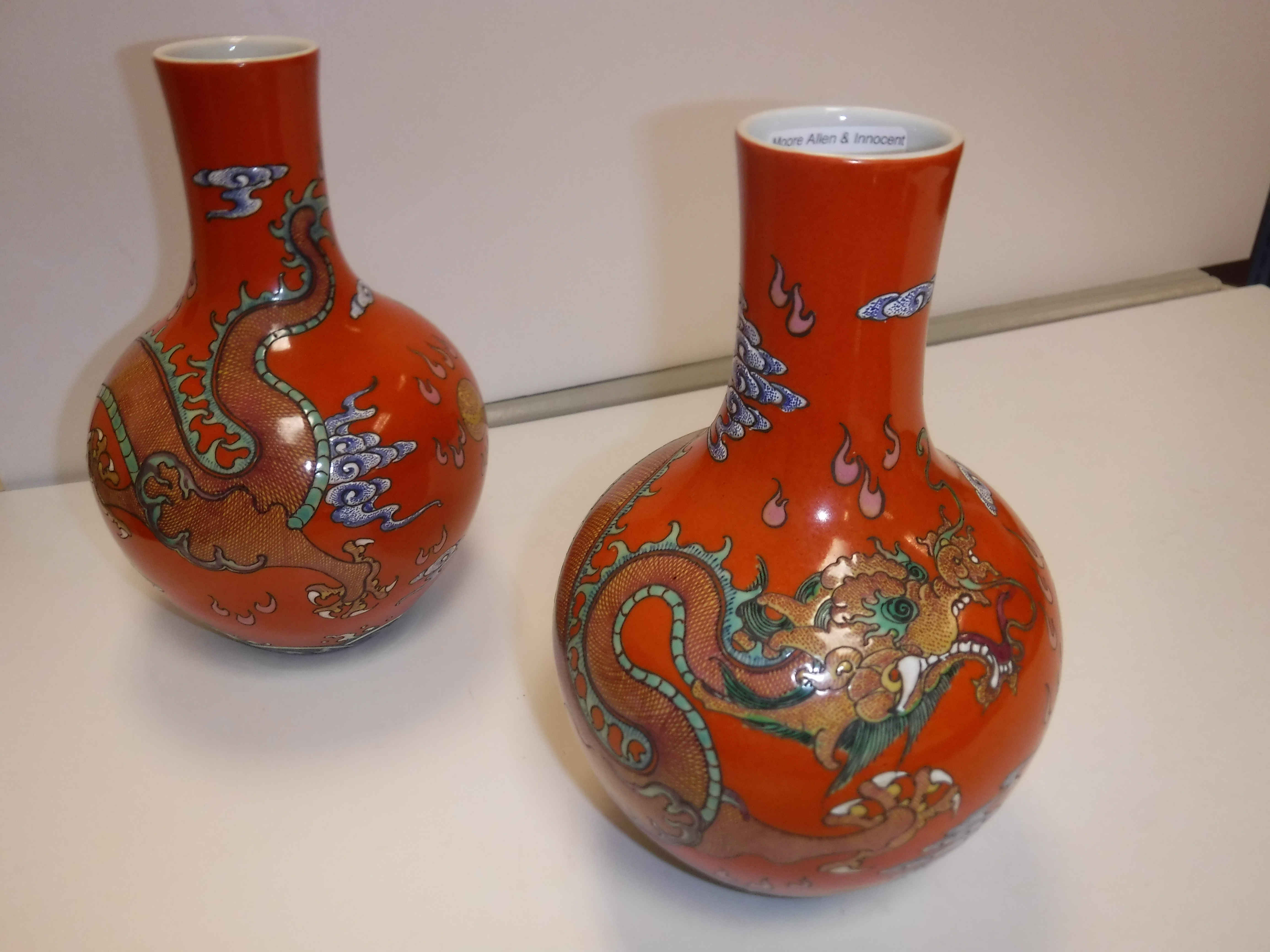 A pair of circa 1900 Chinese oxide red ground five toed dragon decorated vases bearing blue - Image 4 of 18