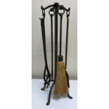 A modern Arts & Crafts style wrought iron fireside companion set,
