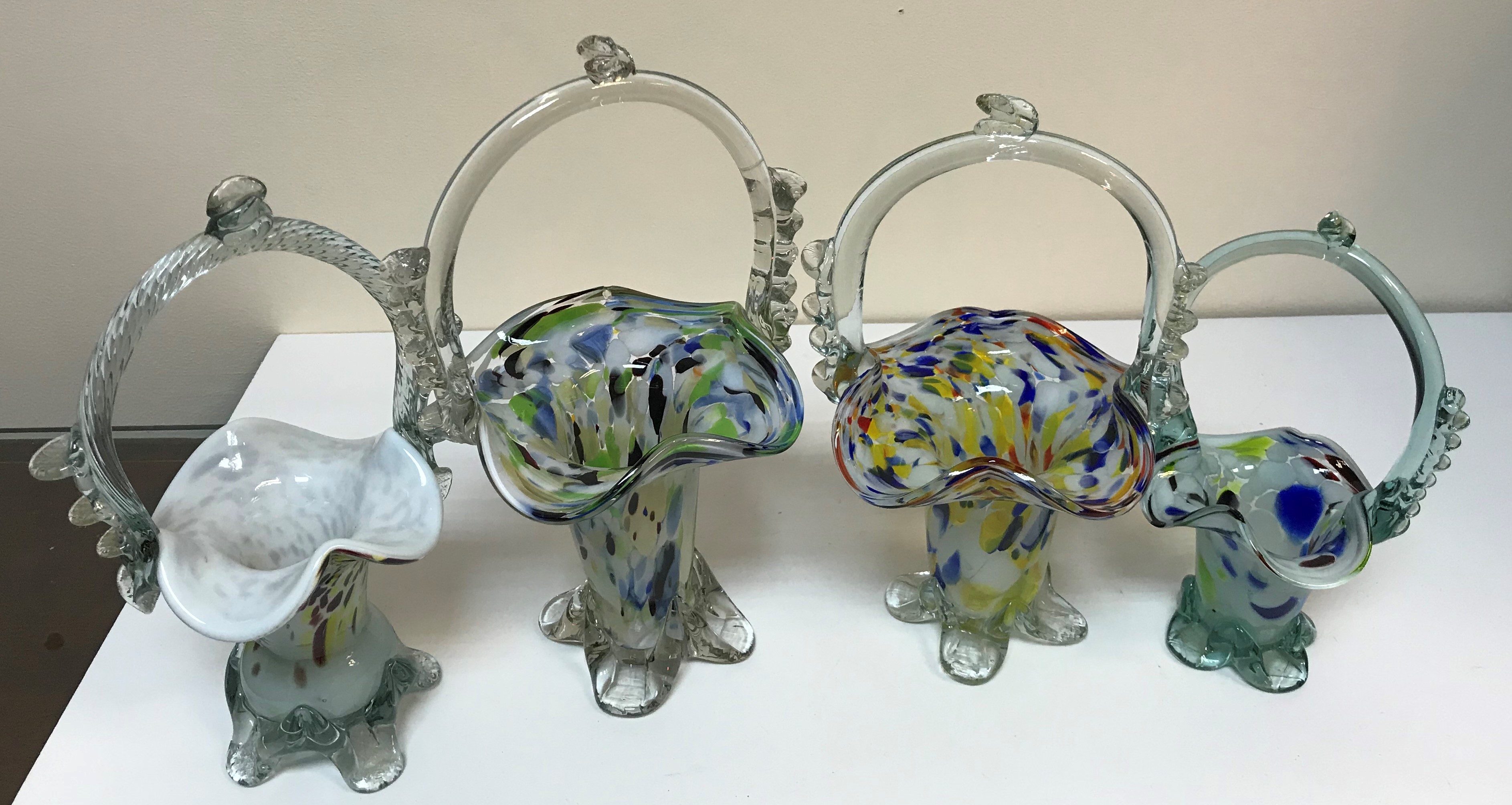 Three boxes of assorted glassware to include Murano style baskets, various vases,