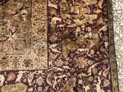 An early 20th Century Agra North India carpet with centre medallion on a wine-coloured ground, - Image 71 of 103