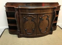 A Victorian rosewood serpentine fronted side cabinet,