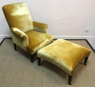 A circa 1900 gold velvet upholstered scroll arm chair on ebonised turned and ringed tapering legs