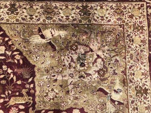 An early 20th Century Agra North India carpet with centre medallion on a wine-coloured ground, - Image 21 of 103