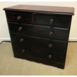 A Victorian mahogany veneered chest of two short and three long graduated drawers with ebonised and