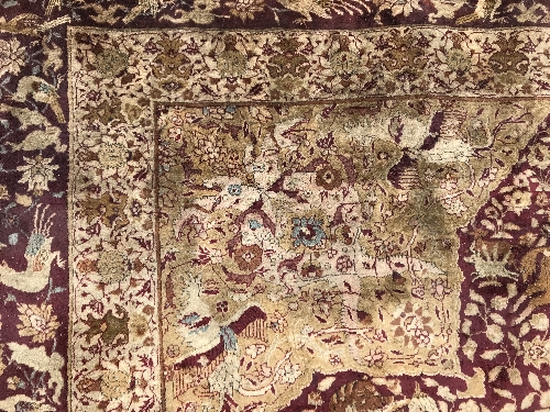 An early 20th Century Agra North India carpet with centre medallion on a wine-coloured ground, - Image 25 of 103