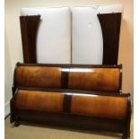 A modern cherry wood sleigh bed in the 19th Century French taste with ViSprung twin base,