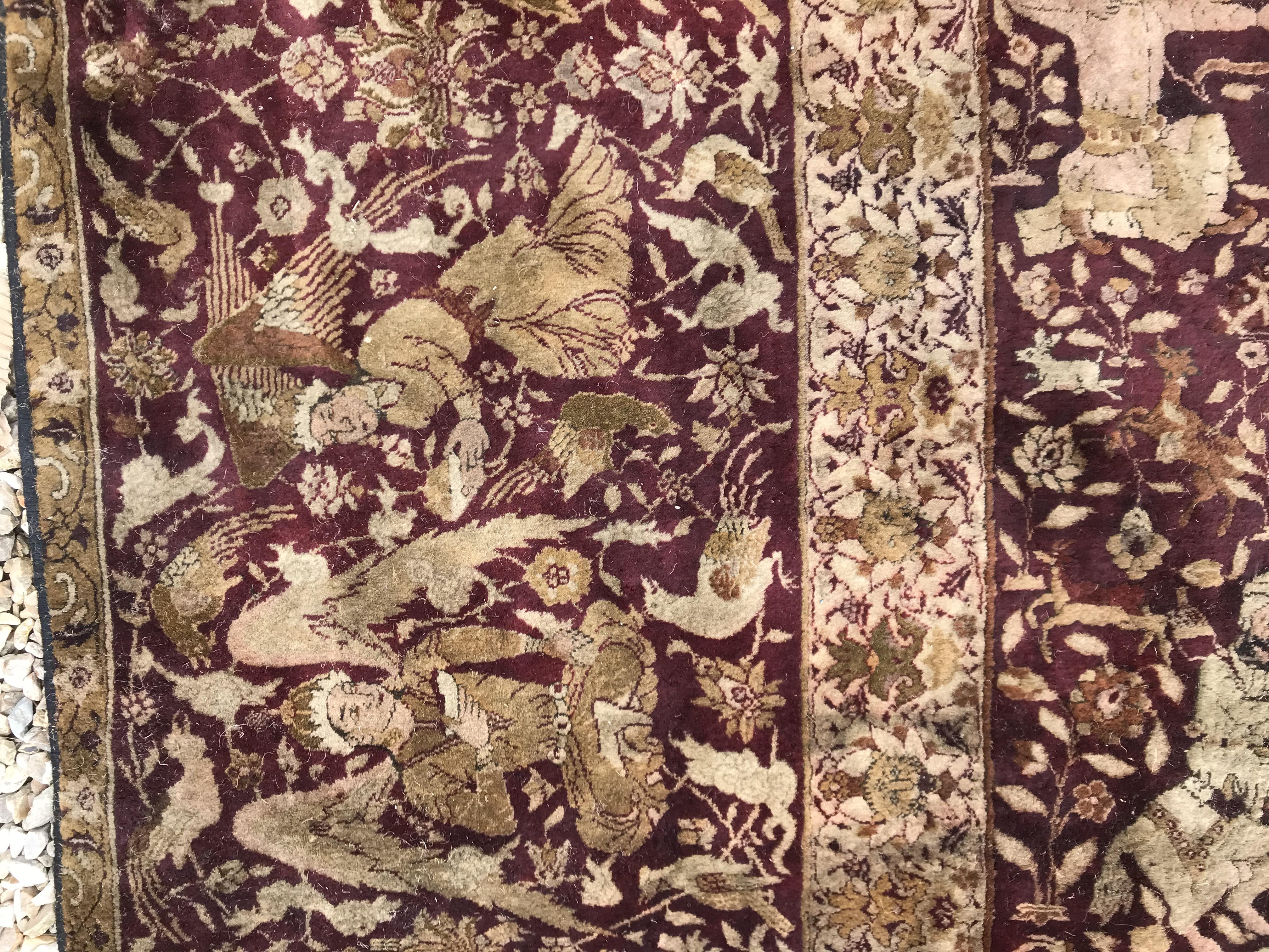 An early 20th Century Agra North India carpet with centre medallion on a wine-coloured ground, - Image 57 of 103