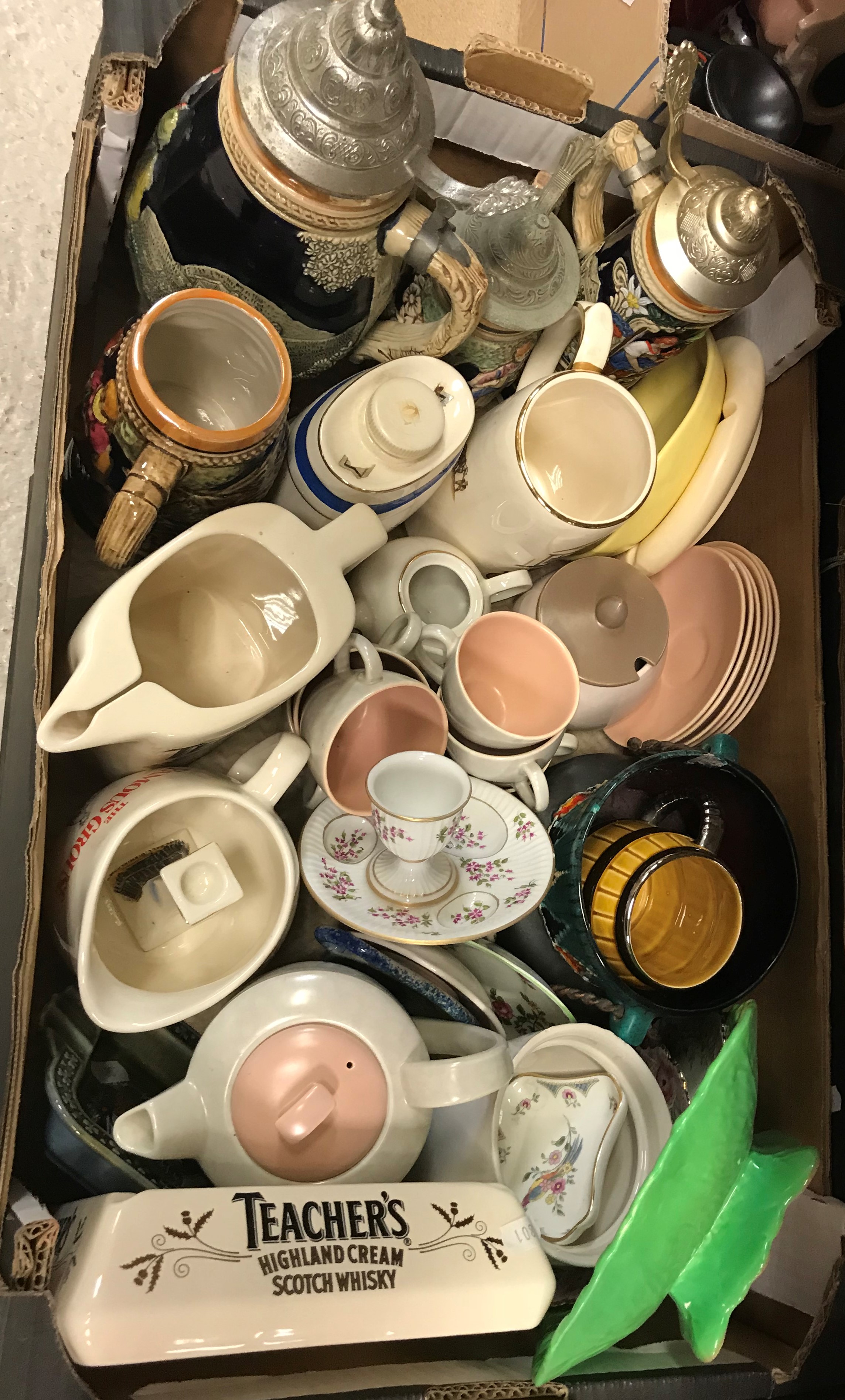 A box containing a Japanese eggshell part tea service,