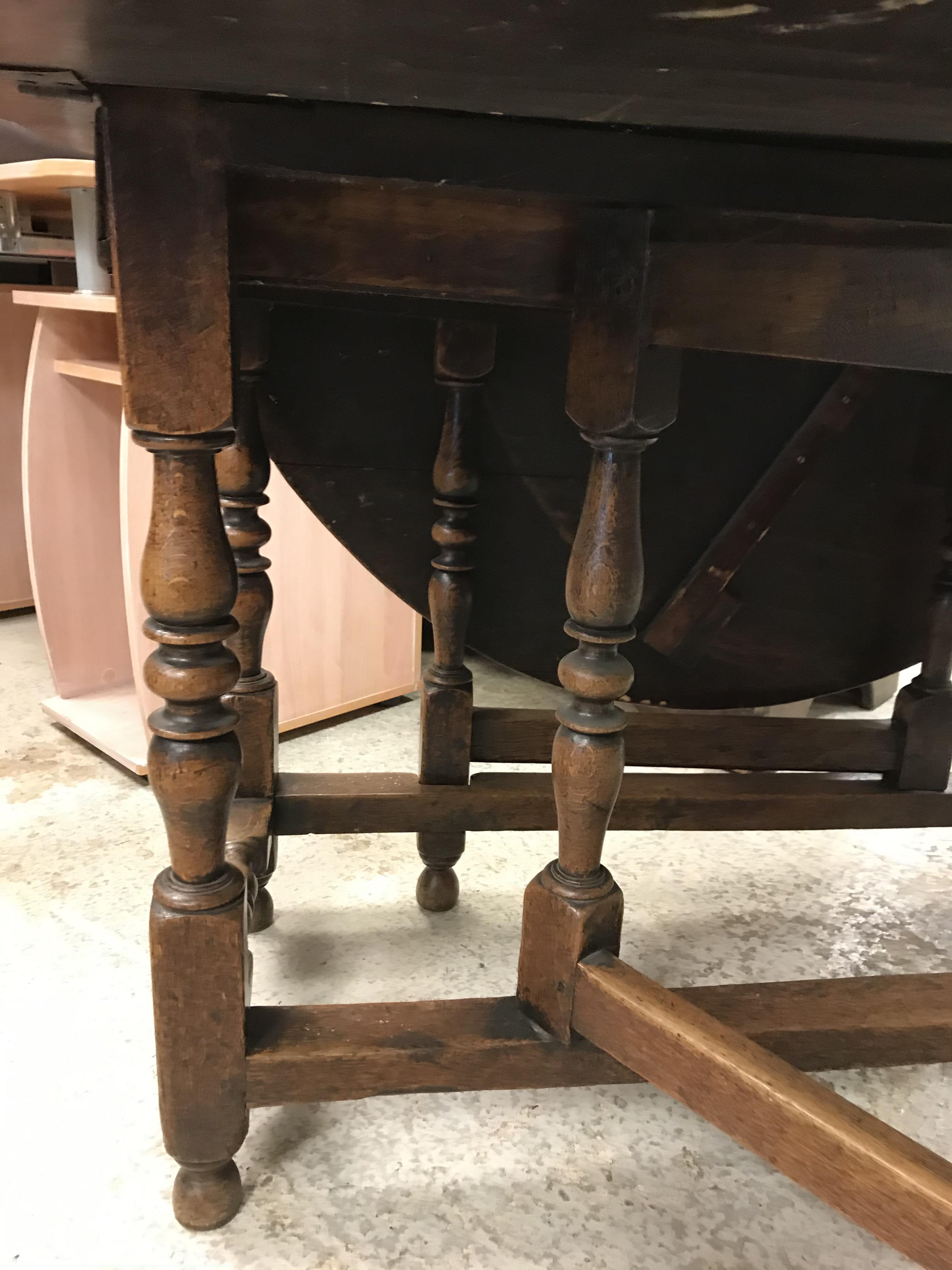 An 18th Century oak gate-leg drop-leaf dining table, - Image 23 of 25