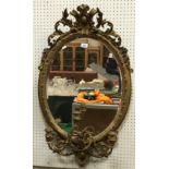 A 19th Century giltwood and gesso framed girandole mirror with all over foliate decoration