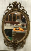 A 19th Century giltwood and gesso framed girandole mirror with all over foliate decoration
