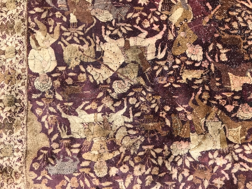 An early 20th Century Agra North India carpet with centre medallion on a wine-coloured ground, - Image 62 of 103