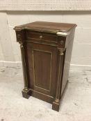 A Russian mahogany and brass embellished pot cupboard with single drawer over cupboard door,