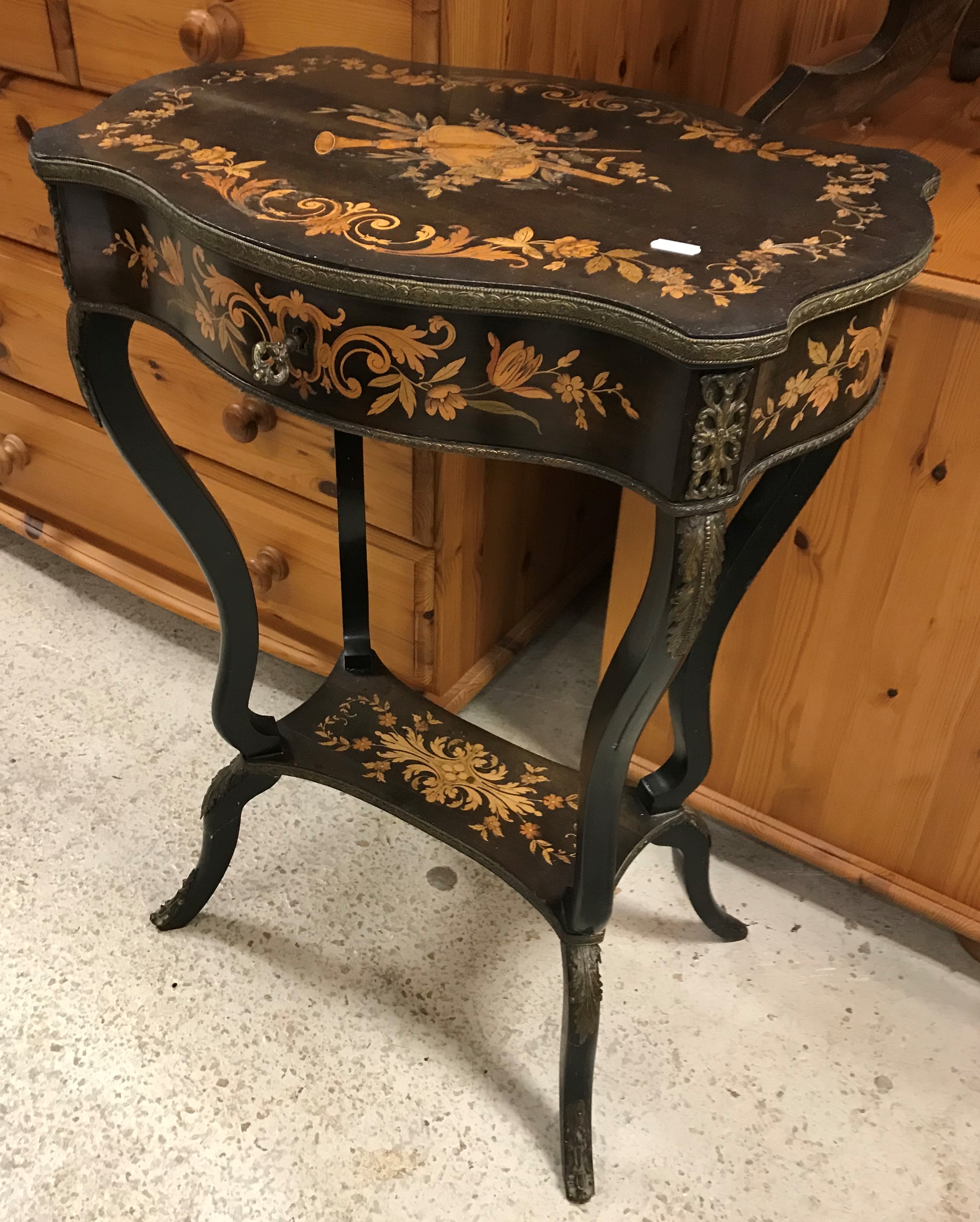 A late 19th Century ebonised and marquetry inlaid work table,