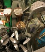 A collection of golf clubs and bag, the clubs including Gruvesol woods No.