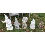 A collection of seven various concrete garden ornaments including gnome cobbler, gnome with basket,