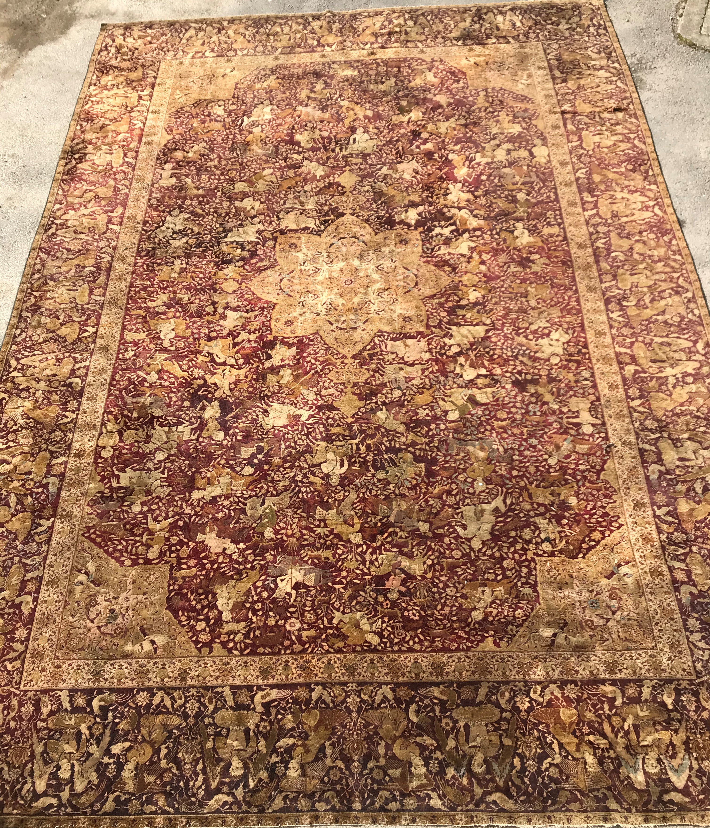 An early 20th Century Agra North India carpet with centre medallion on a wine-coloured ground, - Image 2 of 103