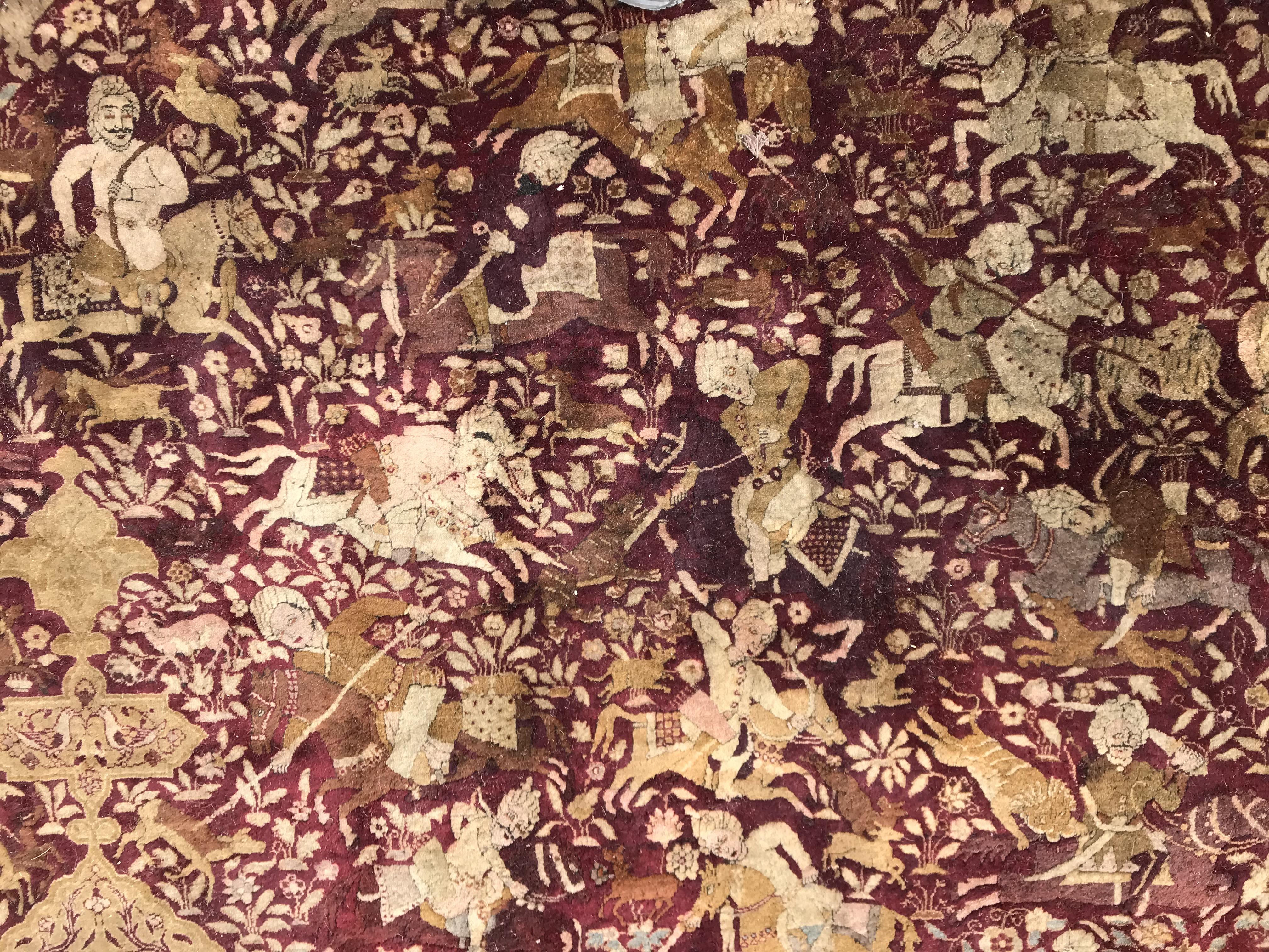 An early 20th Century Agra North India carpet with centre medallion on a wine-coloured ground, - Image 5 of 103