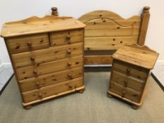 A modern pine chest of two short over four long drawers with turned knob handles,