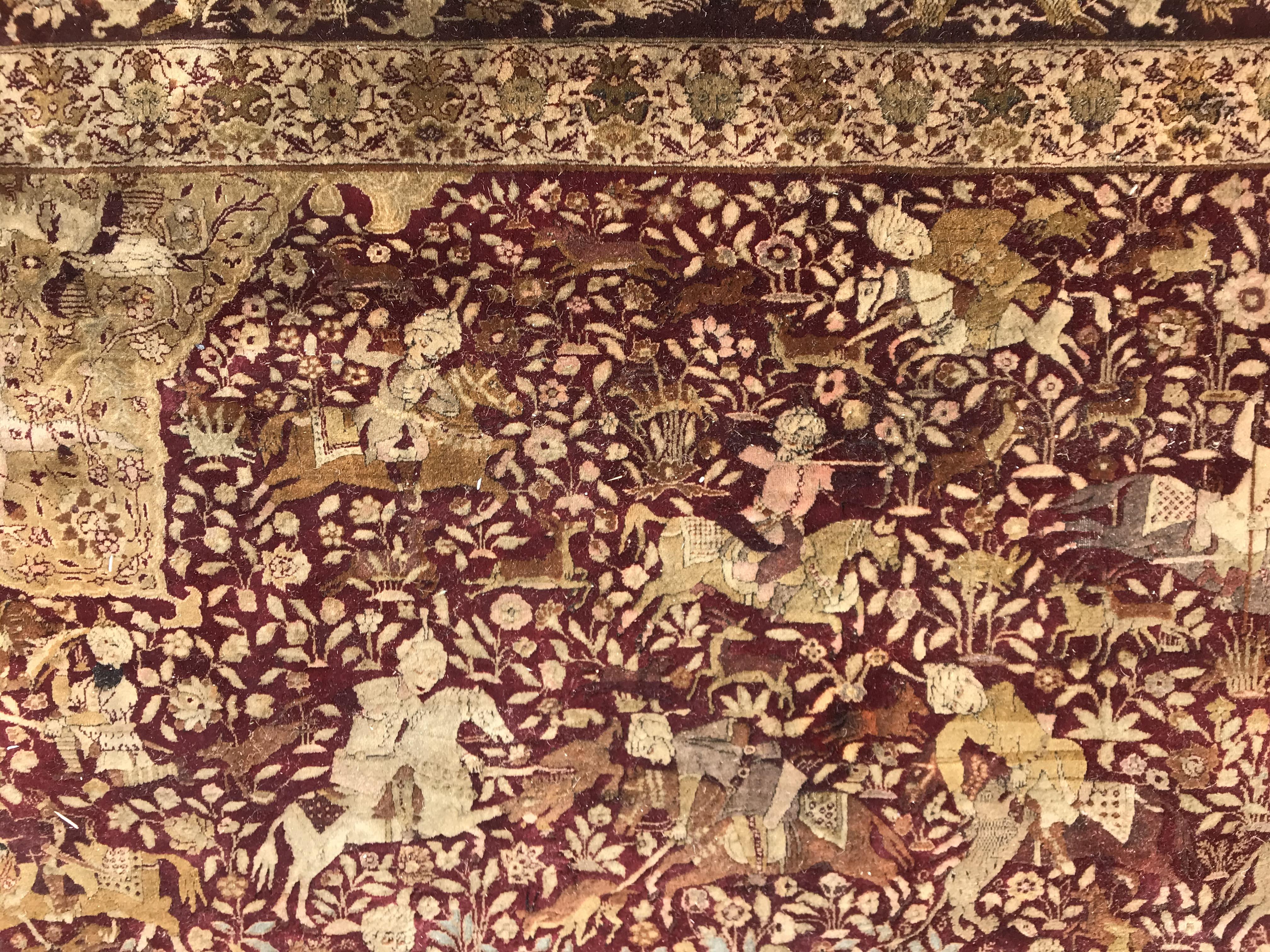 An early 20th Century Agra North India carpet with centre medallion on a wine-coloured ground, - Image 7 of 103