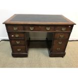 A circa 1900 mahogany kneehole desk,