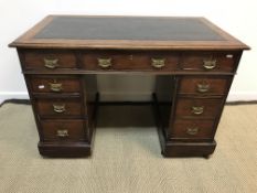 A circa 1900 mahogany kneehole desk,