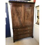 An early 19th Century mahogany linen press,