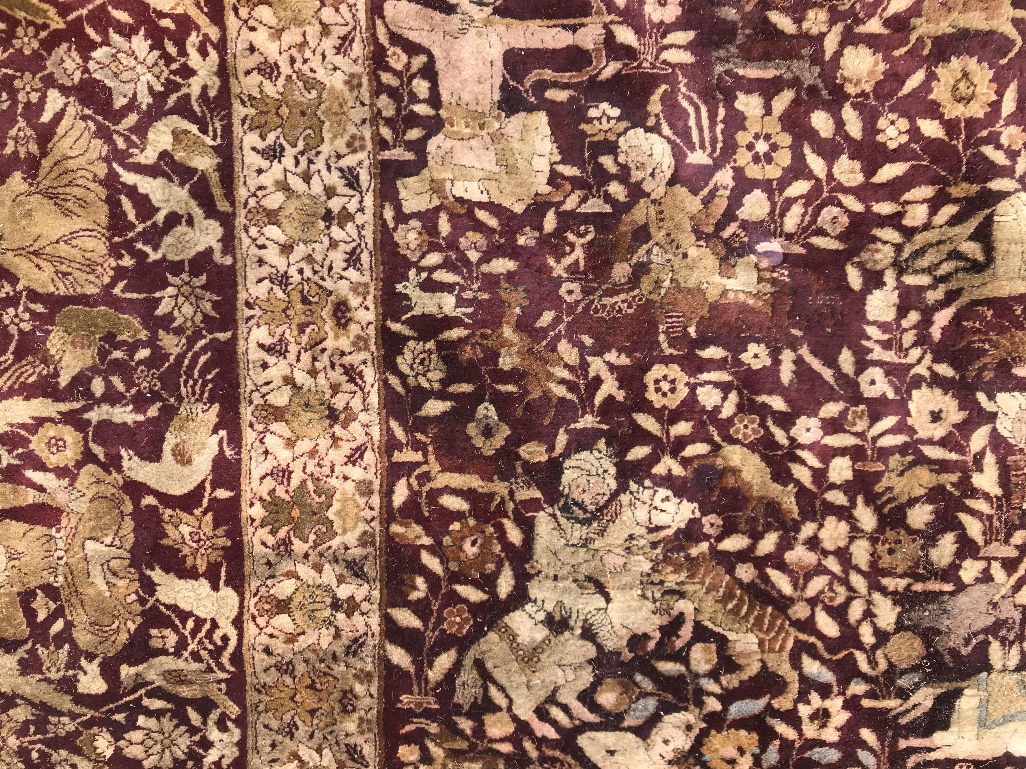 An early 20th Century Agra North India carpet with centre medallion on a wine-coloured ground, - Image 56 of 103