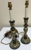 A collection of Middle Eastern style table lamps to include a pair of turned wooden examples with