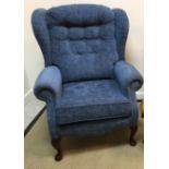 A Sherbourne Upholstery Limited blue chenille covered buttoned wing back scroll armchair on