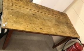 A 19th Century French plank-top farmhouse table, with single frieze drawer on square tapered legs,