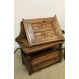 An Ercol side table with rounded rectangular top on turned cup and cover supports over a single