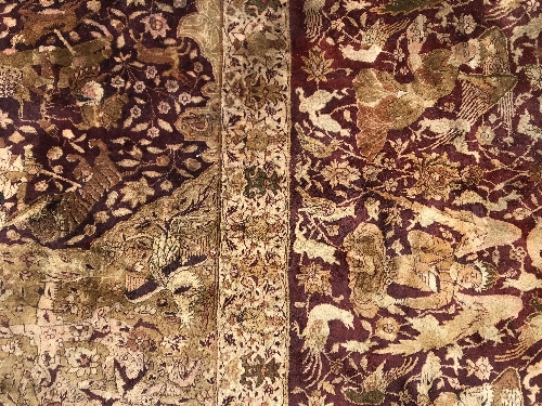 An early 20th Century Agra North India carpet with centre medallion on a wine-coloured ground, - Image 69 of 103