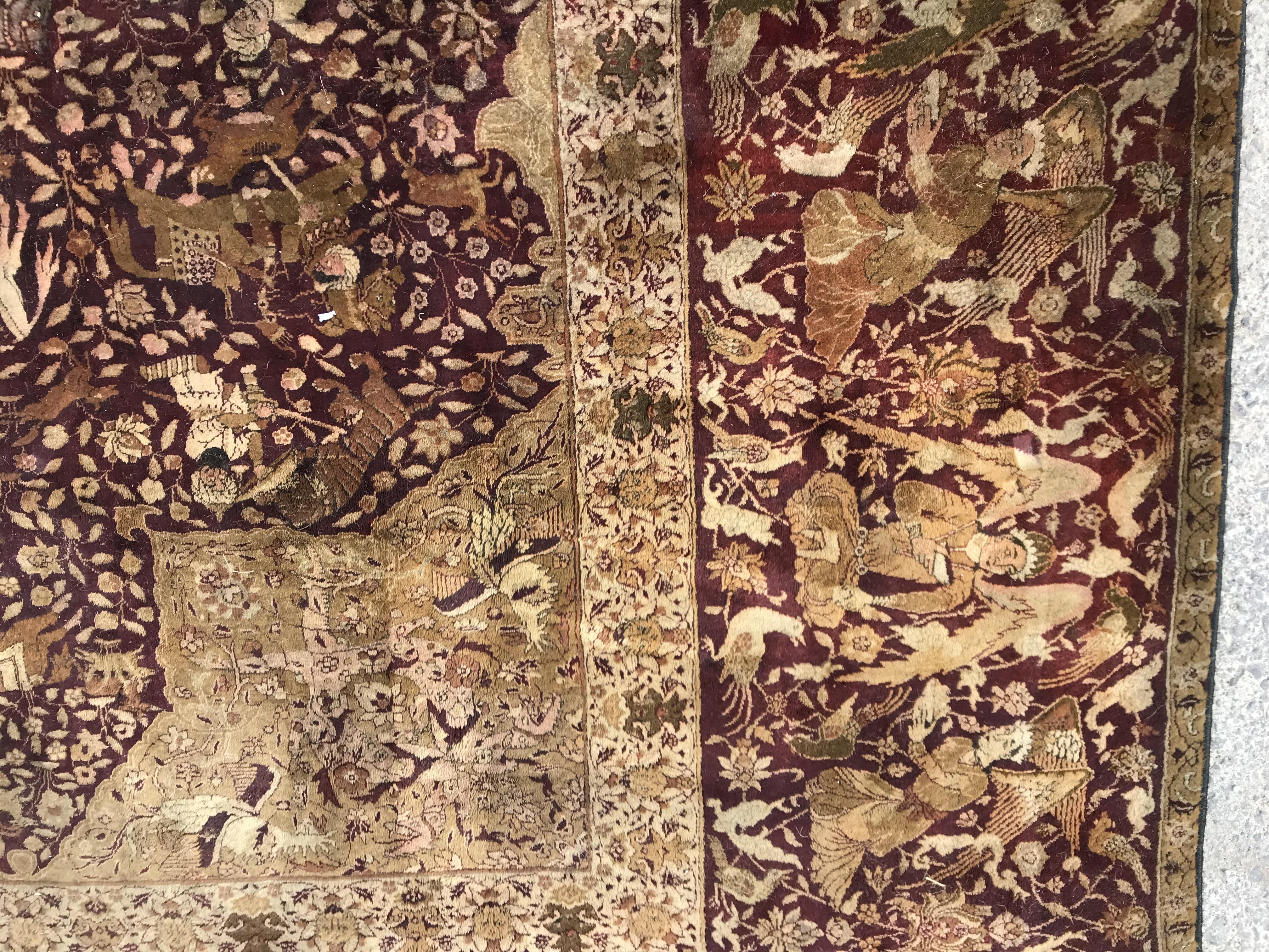 An early 20th Century Agra North India carpet with centre medallion on a wine-coloured ground, - Image 3 of 103