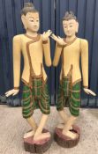 A pair of 20th Century painted and gilded life-size figures of the Buddha,