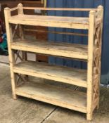 A 20th Century Indian painted teak open shelf unit of four tiers on square supports,