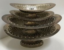 A pair of Victorian silver oval sweetmeat dishes with wrythen embossed decoration,