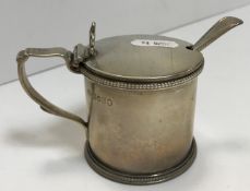 A Victorian silver lidded drum mustard with beaded decoration and pierced thumbpiece (by William