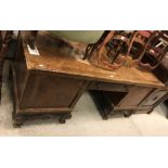 An early 20th Century walnut veneered desk,