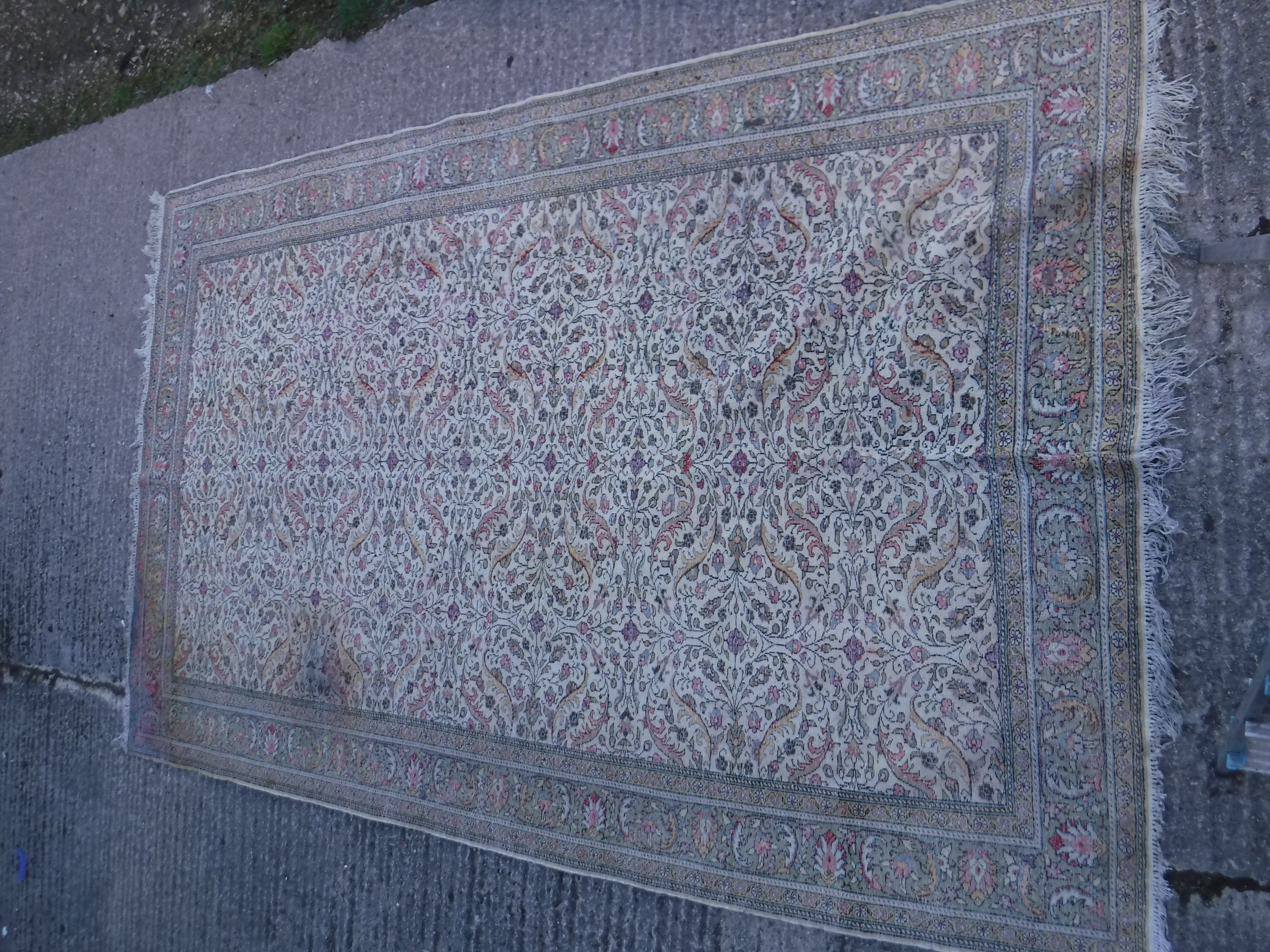 An Oriental carpet, the central panel set with all over floral decoration on a fawn ground, - Image 11 of 11