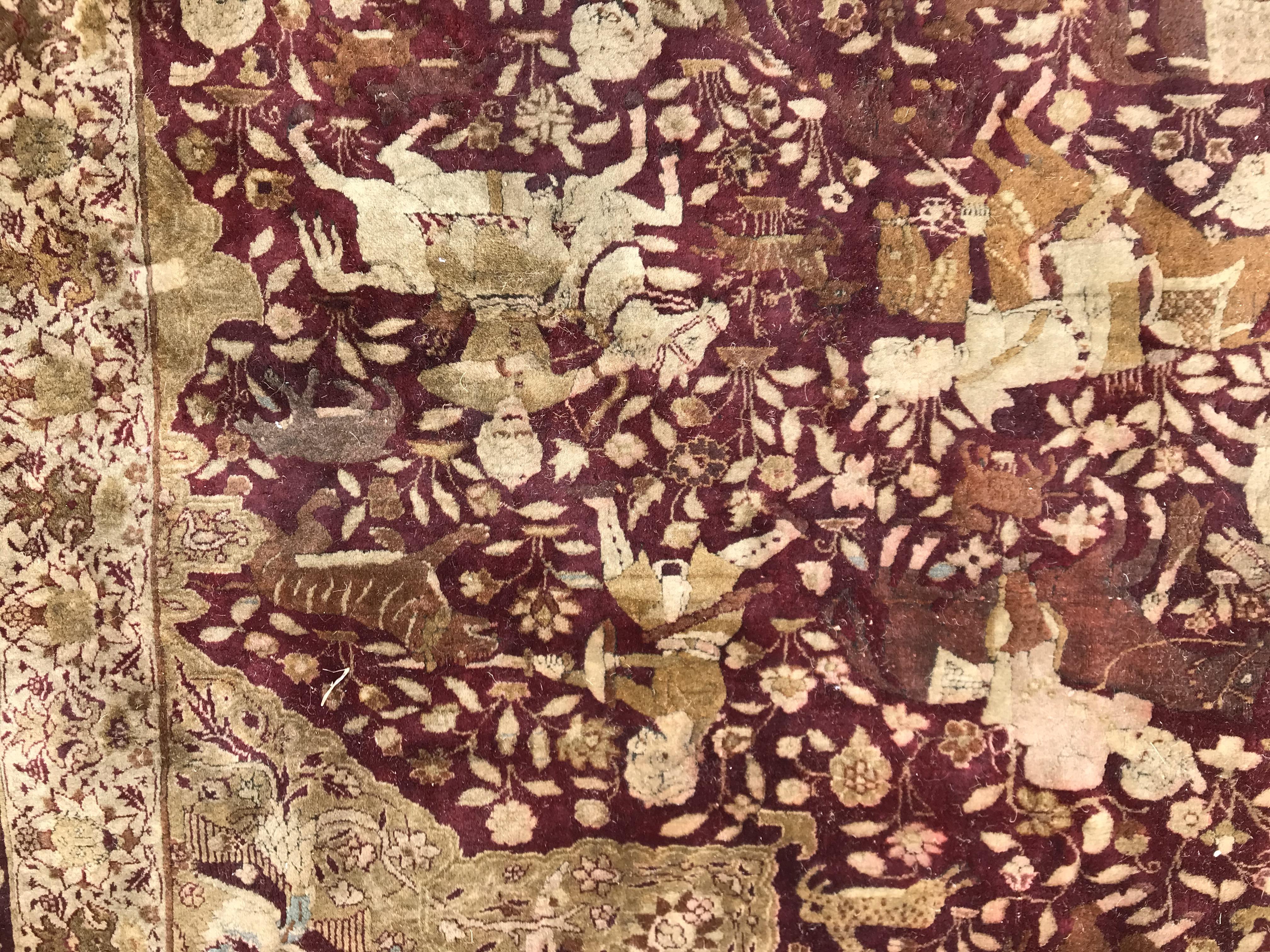 An early 20th Century Agra North India carpet with centre medallion on a wine-coloured ground, - Image 31 of 103