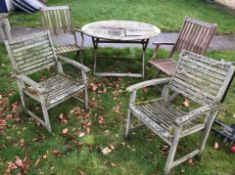 A teak circular folding garden table, 120 cm diameter,