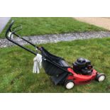 A Lawn King NG464 petrol driven lawn mower with Briggs & Stratton 35 Classic petrol engine,