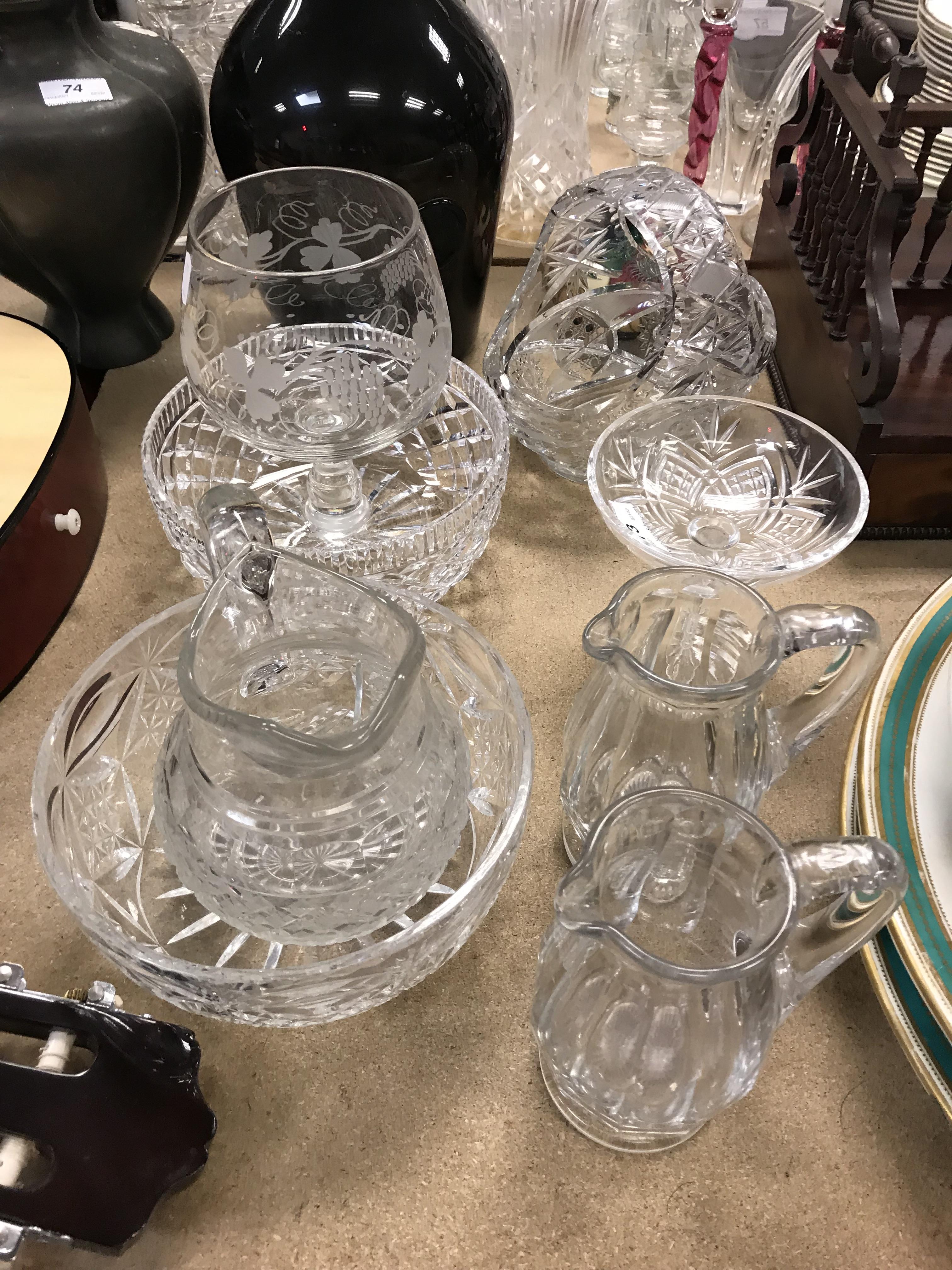 A collection of glassware to include a pair of slab cut jugs raised on pedestal feet, - Image 2 of 2