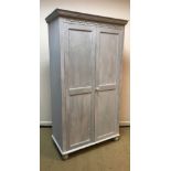 Two modern painted pine two door wardrobes, one with shelf and hanging rail,
