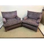 A pair of modern mauve medallion on beige and blue stripe upholstered armchairs on square tapered